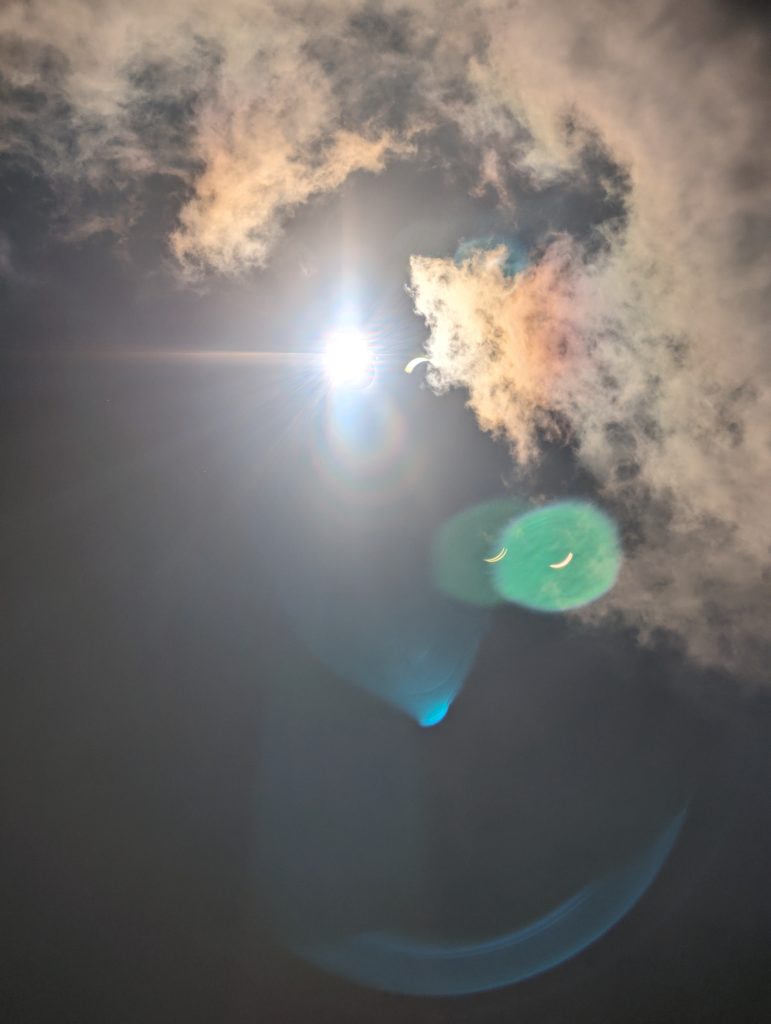 A special lens flare caused by the solar eclipse where the flare appear as crescent shapes instead of the regular circles the sun produces.